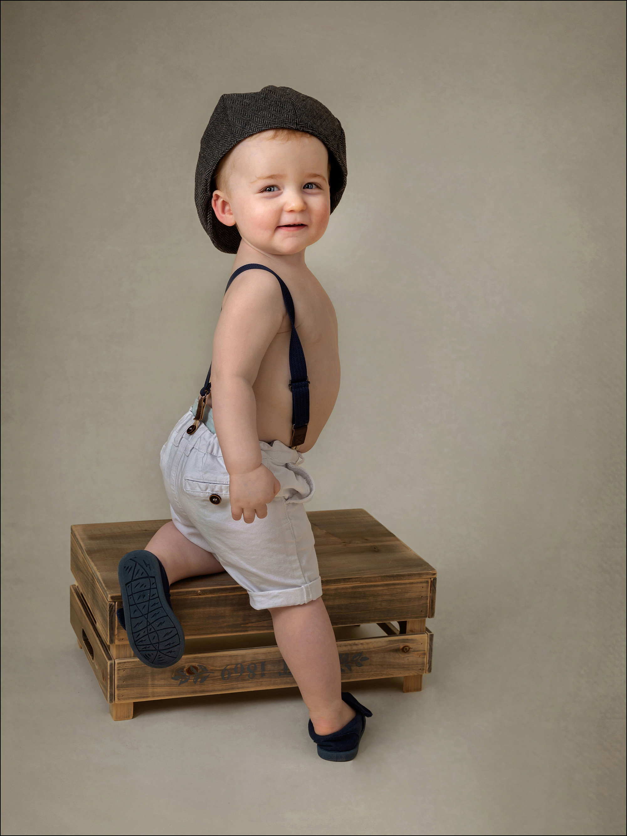 © Red Frog Photography studio portrait of a cute little boy in braces
